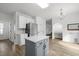 Bright kitchen with a center island, modern appliances, and ample counter space at 5332 Seaspray Ln, Raleigh, NC 27610