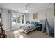 Inviting bedroom with a large window, accent pillows, and decorative artwork at 5504 Quails Call Ct, Garner, NC 27529