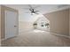 Spacious bedroom with a vaulted ceiling, large window, and neutral carpet at 5504 Quails Call Ct, Garner, NC 27529