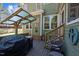 Outdoor deck with grill, cozy seating, and a charming pergola, ideal for entertaining at 5504 Quails Call Ct, Garner, NC 27529