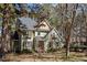 Exterior view of the house featuring a blend of siding, brick, and mature trees at 5504 Quails Call Ct, Garner, NC 27529