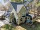 Aerial view of the home exterior highlighting the attached garage, screened porch, and deck area at 5504 Quails Call Ct, Garner, NC 27529
