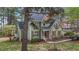 Traditional home with gabled roof, wood shutters and trim, lush landscaping, and a tree-lined property at 5504 Quails Call Ct, Garner, NC 27529