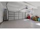 Spacious two-car garage with epoxy floors and ample storage space at 5504 Quails Call Ct, Garner, NC 27529