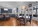Eat-in kitchen featuring custom cabinets, granite countertops, and stainless steel appliances at 5504 Quails Call Ct, Garner, NC 27529