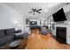 Open living space with hardwood floors, fireplace, and a view into the eat-in kitchen at 5504 Quails Call Ct, Garner, NC 27529