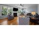 Spacious living room with a fireplace, plush seating, and large windows at 5504 Quails Call Ct, Garner, NC 27529