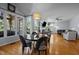 Bright open-concept living and dining area with hardwood floors and lots of natural light at 5504 Quails Call Ct, Garner, NC 27529