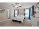 Serene main bedroom featuring plush carpeting, side tables with lamps, and a mirror above the dresser at 5504 Quails Call Ct, Garner, NC 27529