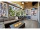 Cozy sunroom with a gas fireplace, comfortable seating, and views of the outdoors at 5504 Quails Call Ct, Garner, NC 27529