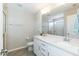 Bright bathroom with a double sink vanity, quartz counters, and modern fixtures plus a separate shower at 5917 Kayton St, Raleigh, NC 27616