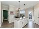 Eat-in kitchen features granite countertops, pendant lights, stainless steel appliances, and backyard access at 5917 Kayton St, Raleigh, NC 27616