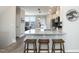 Kitchen island with granite countertops and modern fixtures offer space for entertaining and food prep at 5917 Kayton St, Raleigh, NC 27616