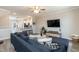 Open-concept living room flowing into the kitchen with modern finishes at 5917 Kayton St, Raleigh, NC 27616