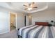 Spacious main bedroom with ensuite bathroom, ceiling fan, and plenty of closet space at 5917 Kayton St, Raleigh, NC 27616