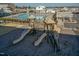 Community playground with slides and climbing features surrounded by a fenced pool area at 5917 Kayton St, Raleigh, NC 27616