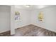 Bedroom featuring new wood-look flooring and two bright windows providing natural light at 608 N 15Th St, Erwin, NC 28339