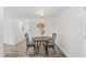 This dining area has a small table with two chairs, a painting, and a decorative plant at 608 N 15Th St, Erwin, NC 28339
