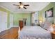 Bright bedroom with hardwood floors, a ceiling fan, and ample space for furnishings at 611 S Buchanan Blvd, Durham, NC 27701