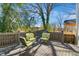 Outdoor deck space with wooden flooring and a set of stylish chairs at 611 S Buchanan Blvd, Durham, NC 27701