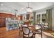 Elegant dining area features hardwood floors, a chandelier, and seamless access to the kitchen, great for Gathering gatherings at 611 S Buchanan Blvd, Durham, NC 27701
