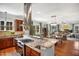 Gourmet kitchen features stainless appliances, marble countertops, breakfast bar, and flows into living areas at 611 S Buchanan Blvd, Durham, NC 27701