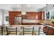 Gourmet kitchen with stainless appliances, marble countertops, eat in bar and stainless range hood at 611 S Buchanan Blvd, Durham, NC 27701