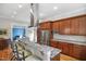A gourmet kitchen features stainless appliances, custom cabinets, marble countertops, and a large island with seating at 611 S Buchanan Blvd, Durham, NC 27701