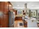 Gourmet kitchen with wood floors, stainless appliances, marble countertops and breakfast bar with seating at 611 S Buchanan Blvd, Durham, NC 27701