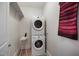 Functional laundry room featuring stacked washer and dryer units, maximizing space at 611 S Buchanan Blvd, Durham, NC 27701