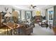Cozy living room with a brick fireplace, large windows, and comfortable seating arrangement, perfect for relaxation at 611 S Buchanan Blvd, Durham, NC 27701