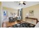 Comfortable main bedroom featuring sitting area with accent chairs, plush carpet, and an abundance of natural light at 611 S Buchanan Blvd, Durham, NC 27701