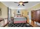 Spacious main bedroom featuring a four-poster bed, stylish carpet, and natural light at 611 S Buchanan Blvd, Durham, NC 27701
