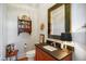 A stylish powder room featuring a stylish vanity, toilet, and decor at 611 S Buchanan Blvd, Durham, NC 27701