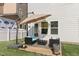 Backyard patio with umbrella and seating area at 625 Sage Oak Ln, Holly Springs, NC 27540