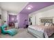 Spacious bedroom with a bed, chaise lounge, and a makeup vanity area at 625 Sage Oak Ln, Holly Springs, NC 27540
