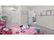 Whimsical bedroom with a Hello Kitty theme, dollhouse, and a bright, airy feel at 625 Sage Oak Ln, Holly Springs, NC 27540