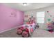 Charming pink themed bedroom with decor, a playful bed, and bright natural light at 625 Sage Oak Ln, Holly Springs, NC 27540