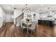 Open floor plan featuring dining area and kitchen with an island and bar seating at 625 Sage Oak Ln, Holly Springs, NC 27540