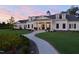 Beautiful home exterior with manicured lawn, brick path, and inviting entrance at 625 Sage Oak Ln, Holly Springs, NC 27540