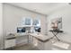 Inviting office with an expansive desk, dual monitors, and an inspiring artistic accent wall at 625 Sage Oak Ln, Holly Springs, NC 27540