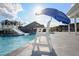 Inviting community pool area featuring slide and lifeguard chair at 625 Sage Oak Ln, Holly Springs, NC 27540