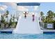 Fun pool area with a large water slide for recreation at 625 Sage Oak Ln, Holly Springs, NC 27540