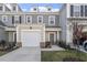 Inviting townhome with a well-manicured lawn and a convenient garage, blending comfort and curb appeal at 63 Pale Moss Dr, Clayton, NC 27527
