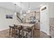 Well-appointed kitchen featuring a central island with barstool seating and stainless steel appliances at 63 Pale Moss Dr, Clayton, NC 27527