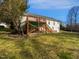 Large backyard featuring a deck with stairs leading to the yard at 6624 Professor St, Raleigh, NC 27616