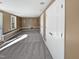 Spacious finished basement with neutral carpet, trim, and paint and natural light from windows at 6624 Professor St, Raleigh, NC 27616