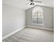 Bedroom featuring a vaulted ceiling and large window at 6624 Professor St, Raleigh, NC 27616