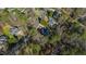Aerial view of a neighborhood showcasing the home's location within a community with tree-lined streets at 6816 Rainwater Rd, Raleigh, NC 27615