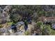 An aerial view of the home nestled among trees in a neighborhood, showcasing its location and surrounding landscape at 6816 Rainwater Rd, Raleigh, NC 27615